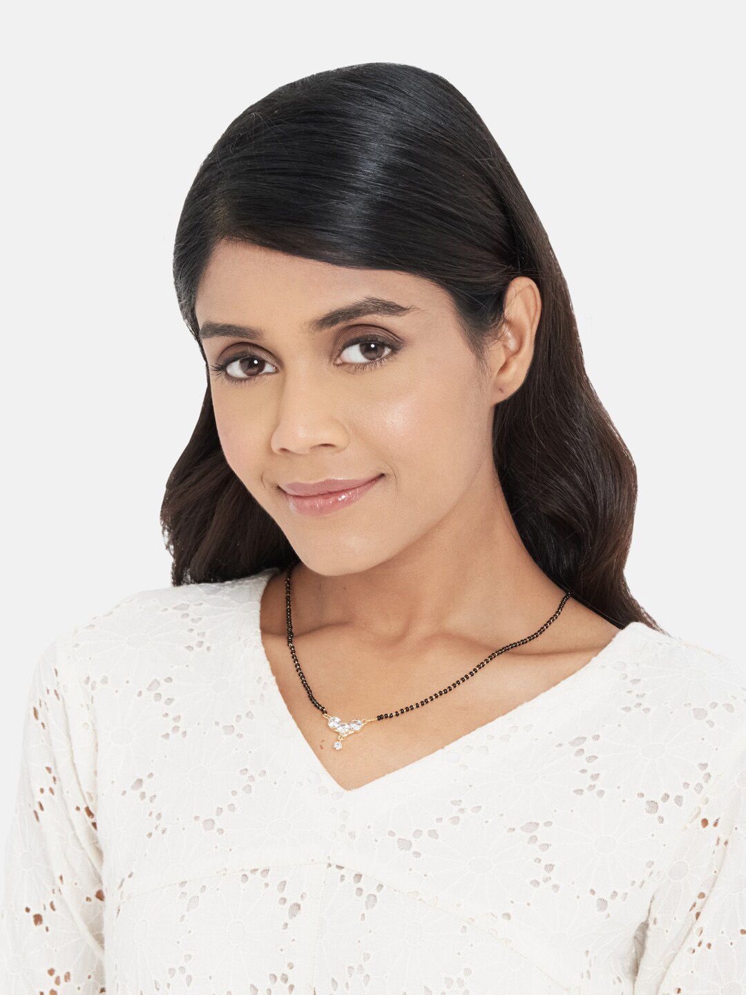 ATIBELLE Gold-Plated White AD-Studded Black Beaded Mangalsutra