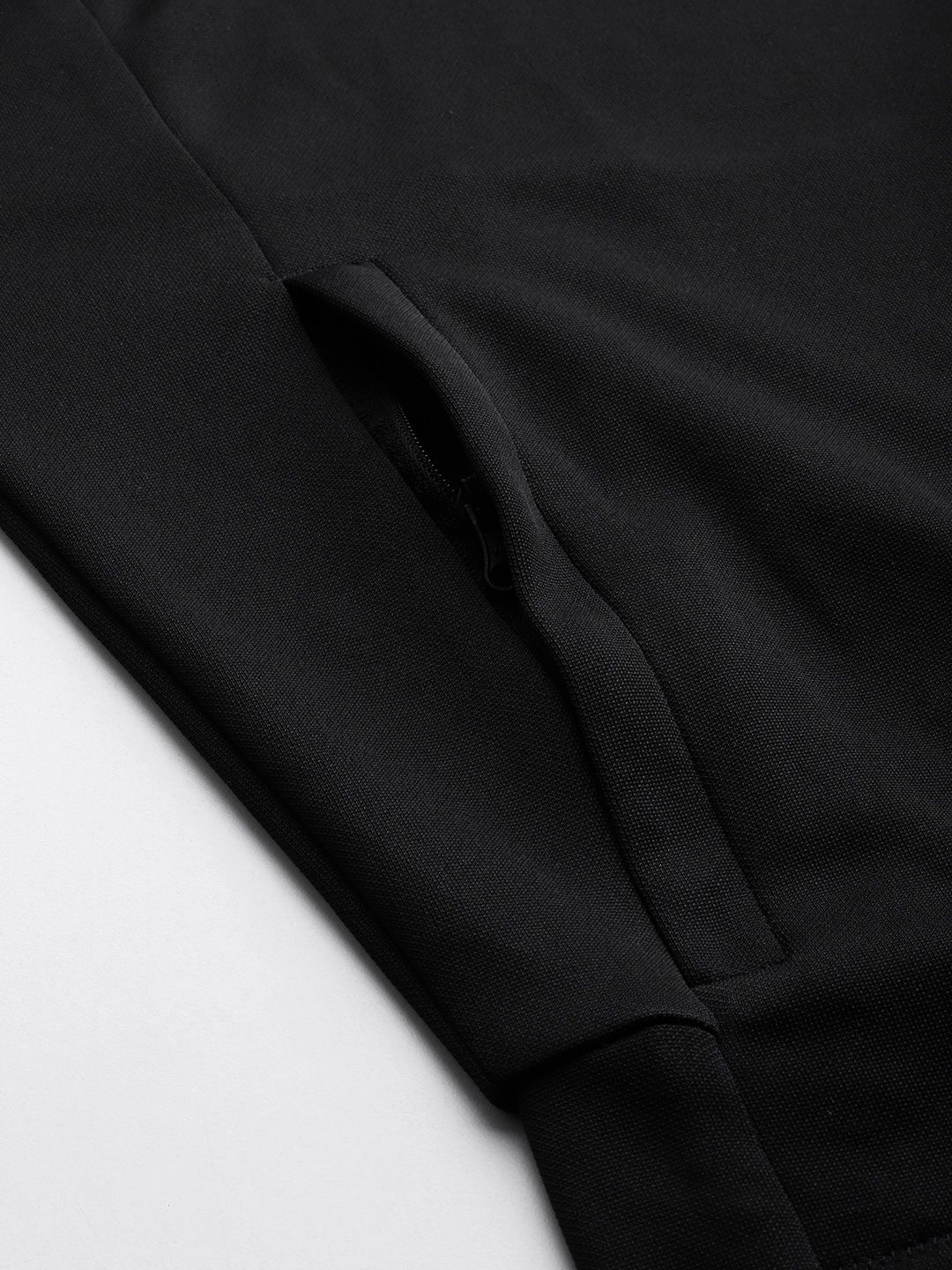 Track jacket concealed zipper pocket detail