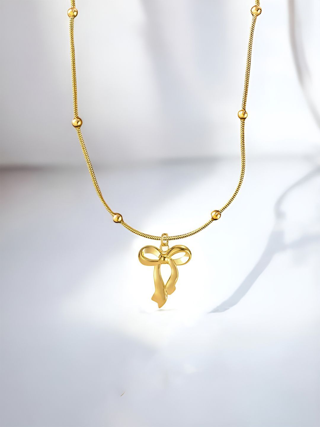 Jewels Galaxy Gold-Plated Anti Tarnish Stainless Steel Bow Shaped Pendant with Chain-picture-25