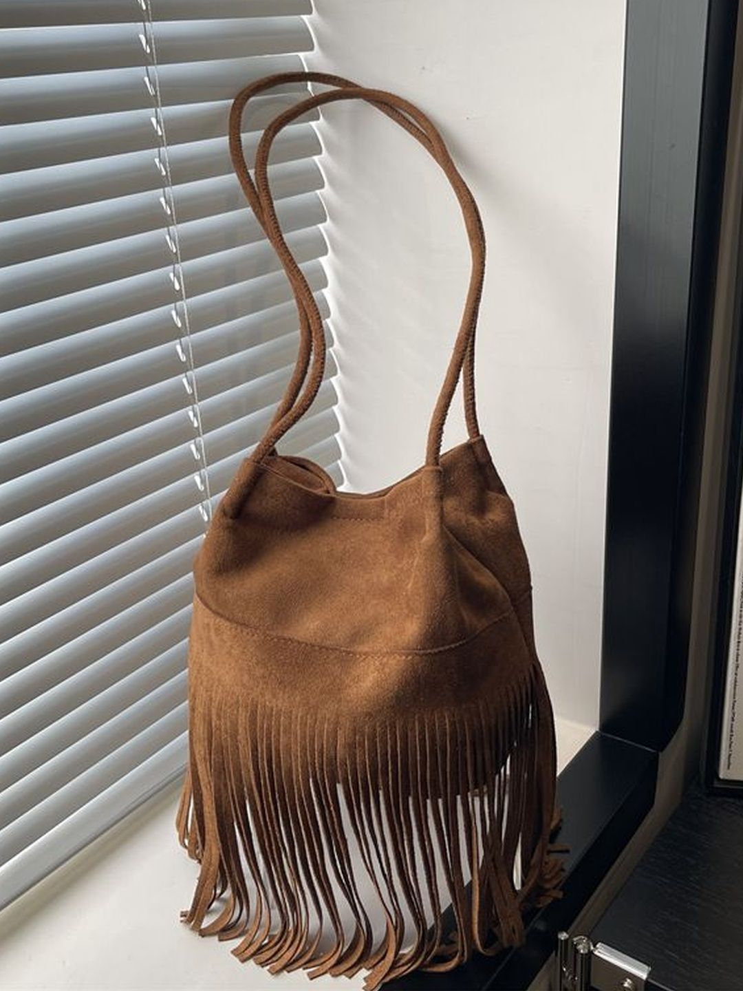 CORSICA Textured Sling Bag with Fringed-picture-32