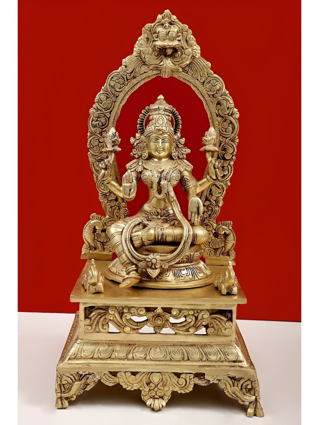 Exotic India Gold-Toned Goddess Lakshmi Sitting On Pedestal Religious Idol Showpiece-image-23