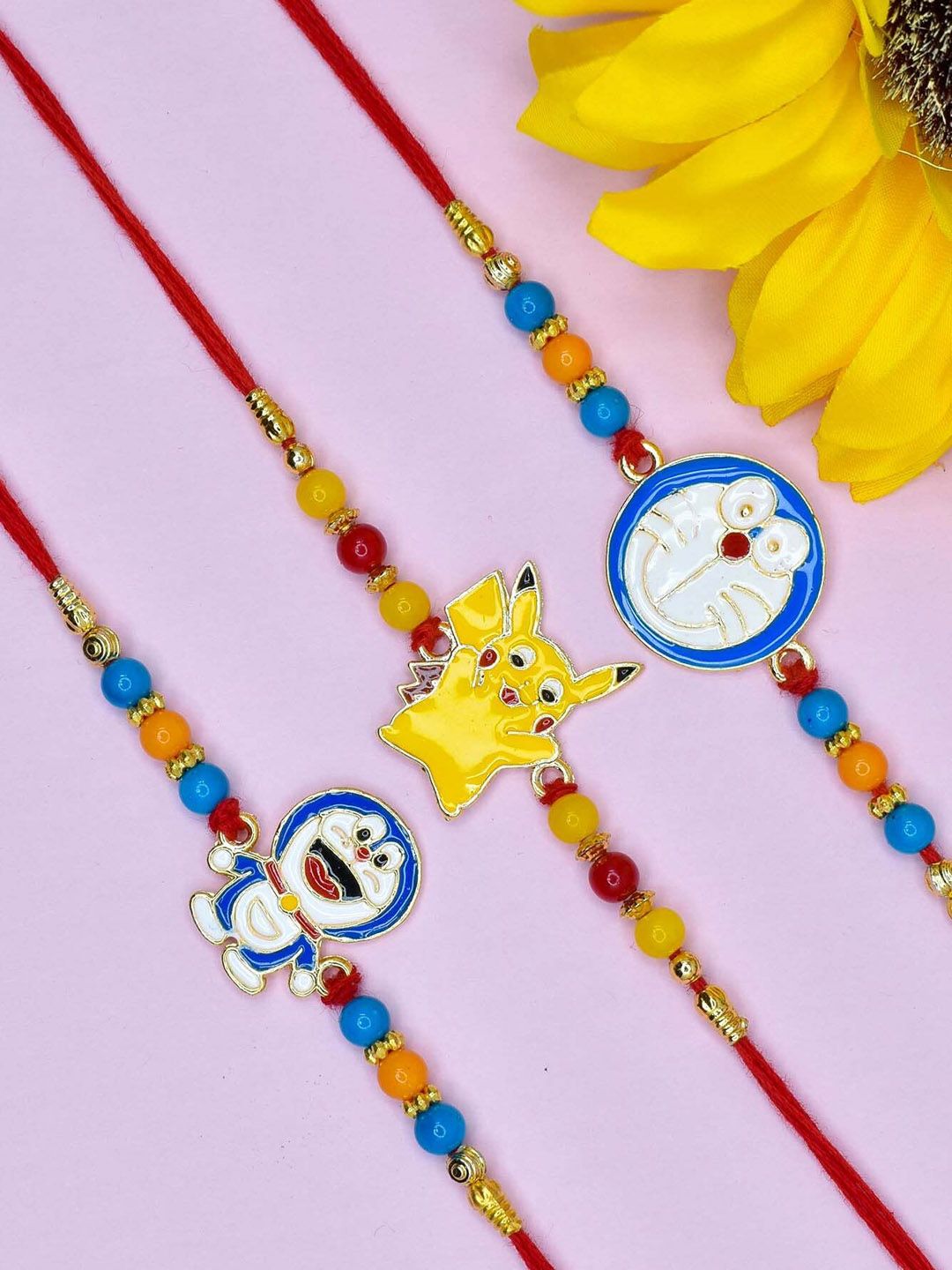 MEIRA JEWELLERY Set Of 3 Pikachu & Doremon Rakhis With Greeting Card & Roli Chawal-image-26