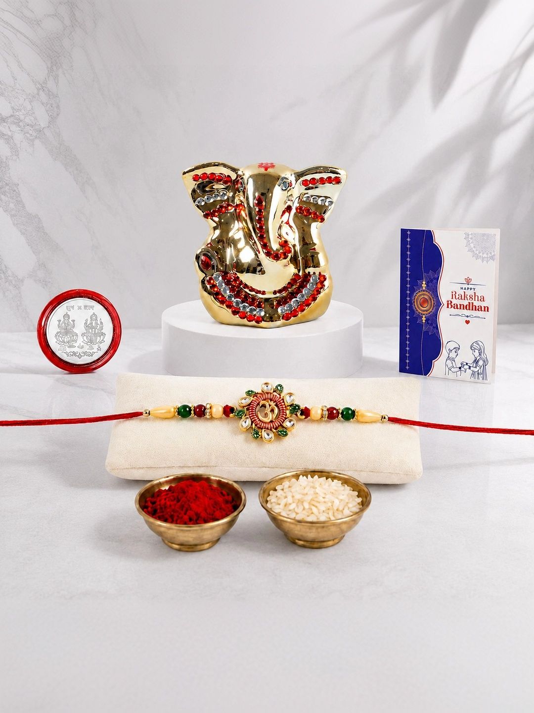 Myntra Elegant Homes Rakhi With Greeting Card Ganesh Idol Silver Coin & Roli Chawal-picture-33