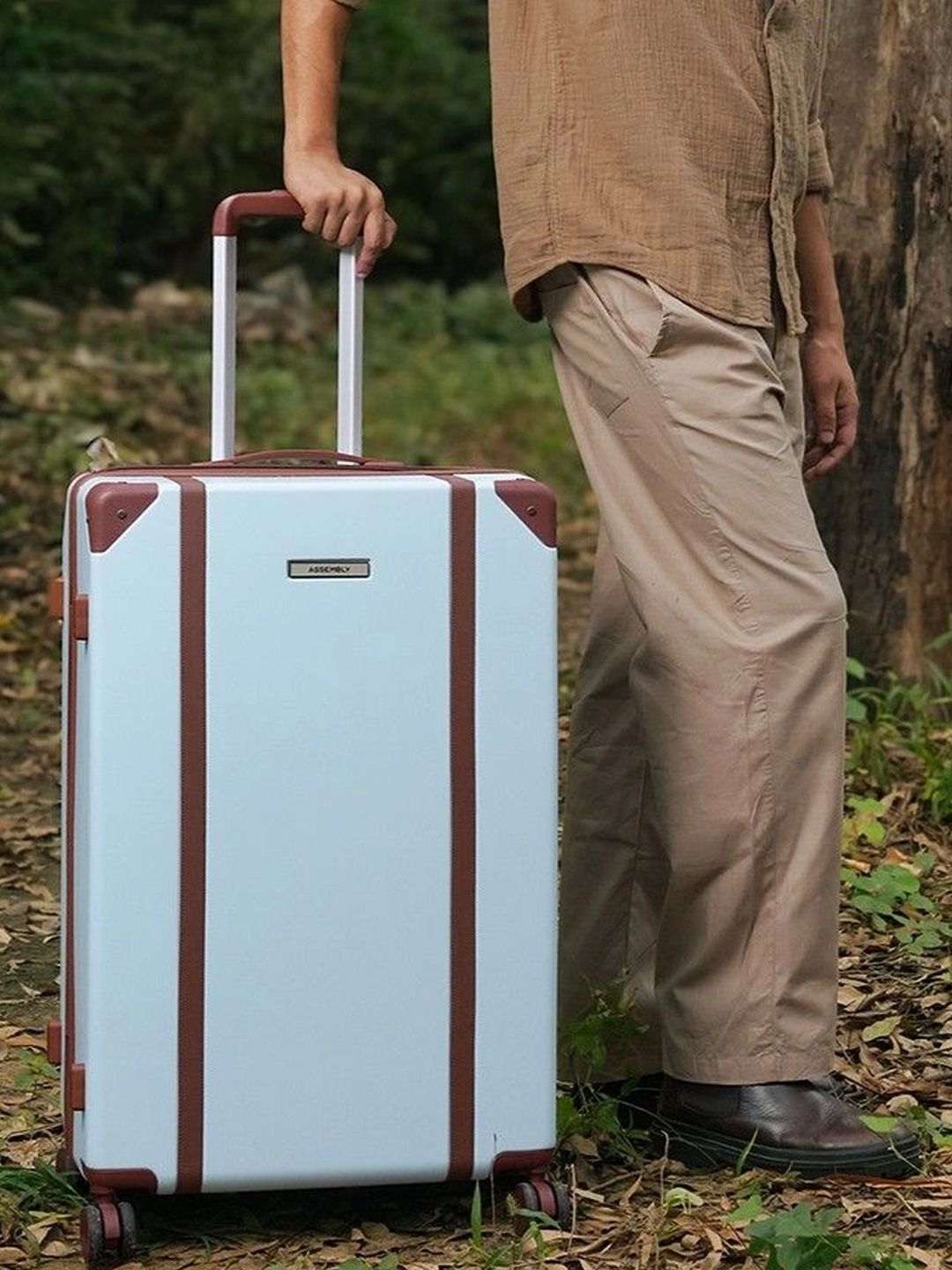 Assembly Vintage Solid Compression Straps 8 Wheel Large Trolley Bag- 108L deal from myntra