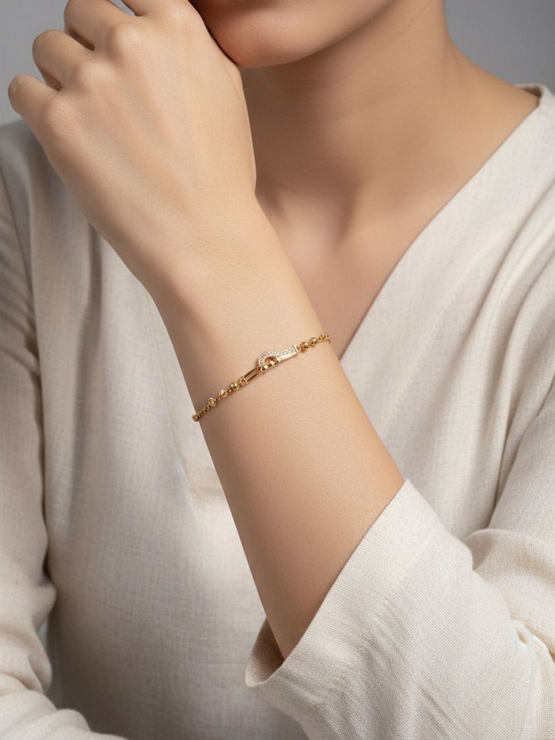 Anouk Women Brass American Diamond Gold-Plated Link Bracelet