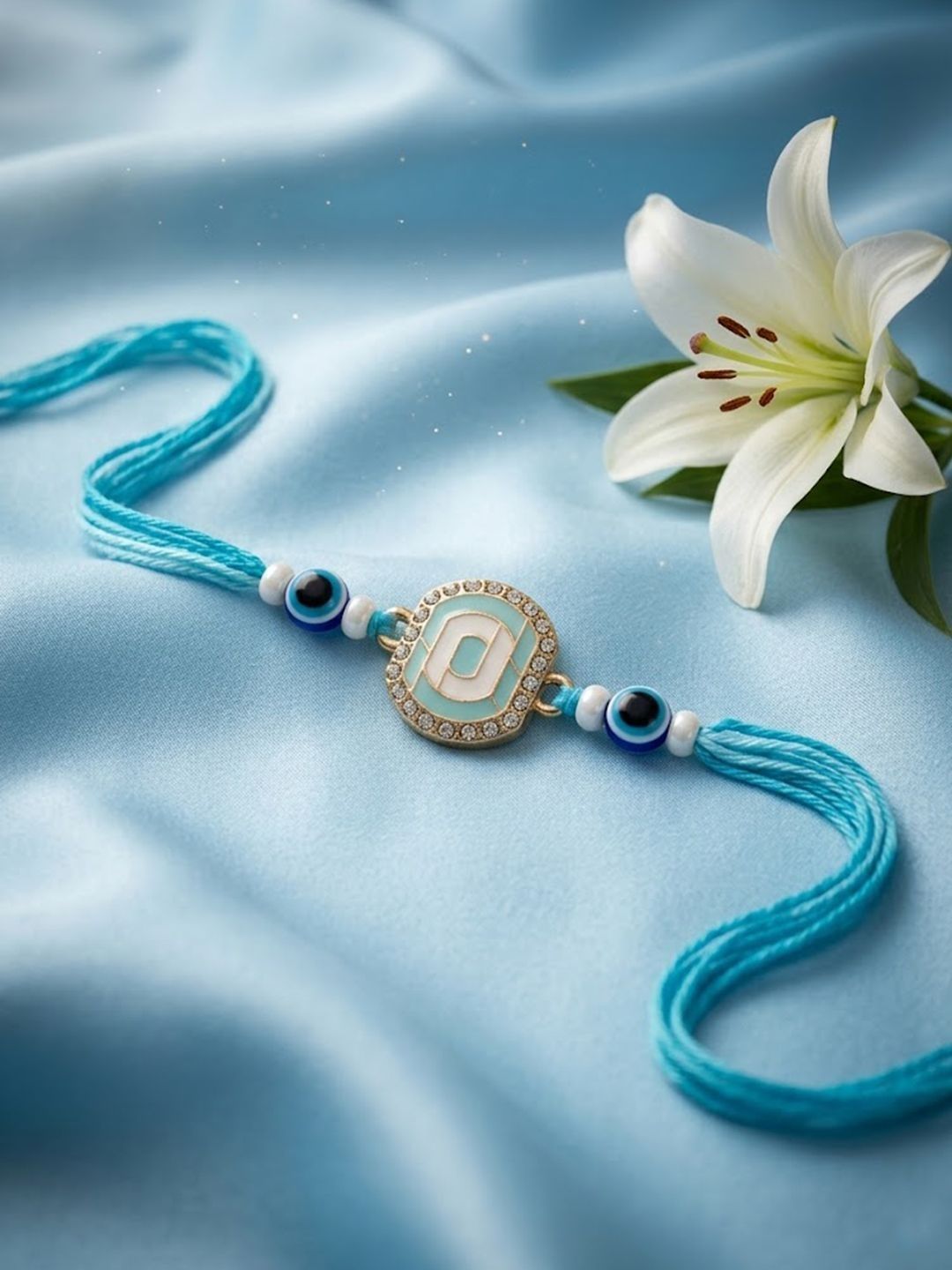 SZN Blue Evil Eye & Artificial Stones Oval Shape Thread Rakhi With Roli Chawal Chandan-image-40