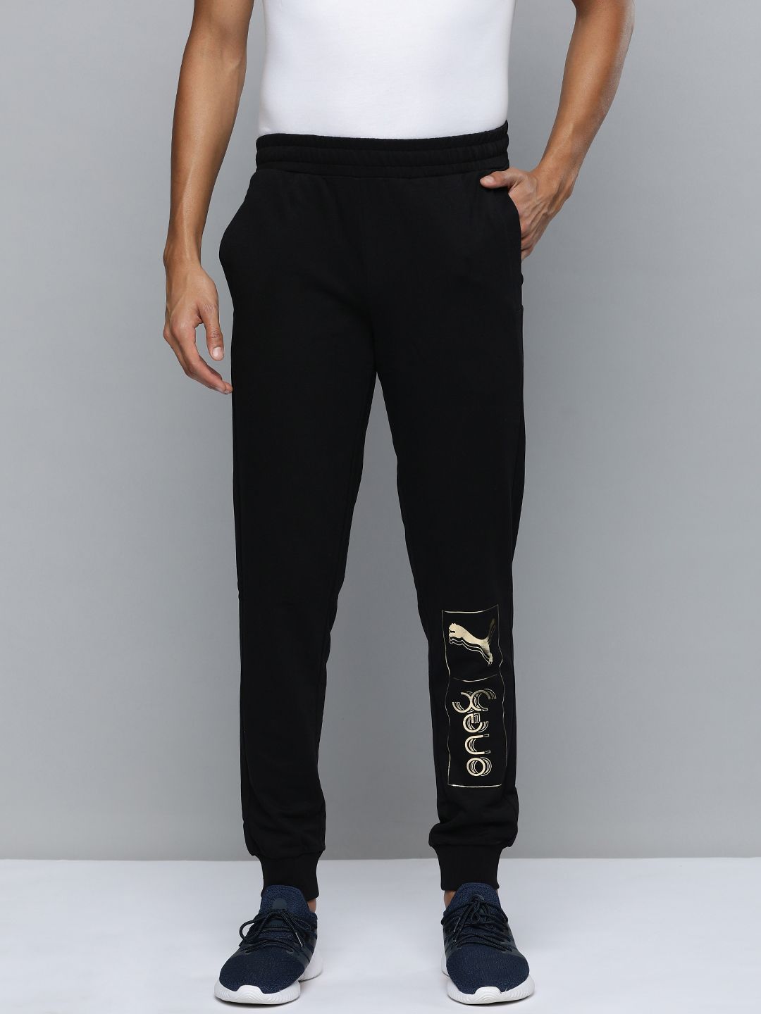 Buy One8 X PUMA Men Solid Mid Rise Knitted Slim Fit Track Pants - Track  Pants for Men 21532818 | Myntra