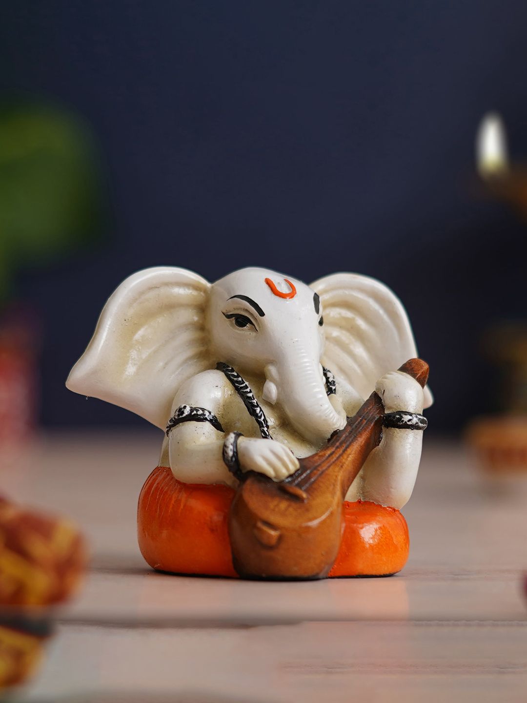 eCraftIndia White & Orange Lord Ganesha Idol Playing Veena Polyresin Showpiece-image-49