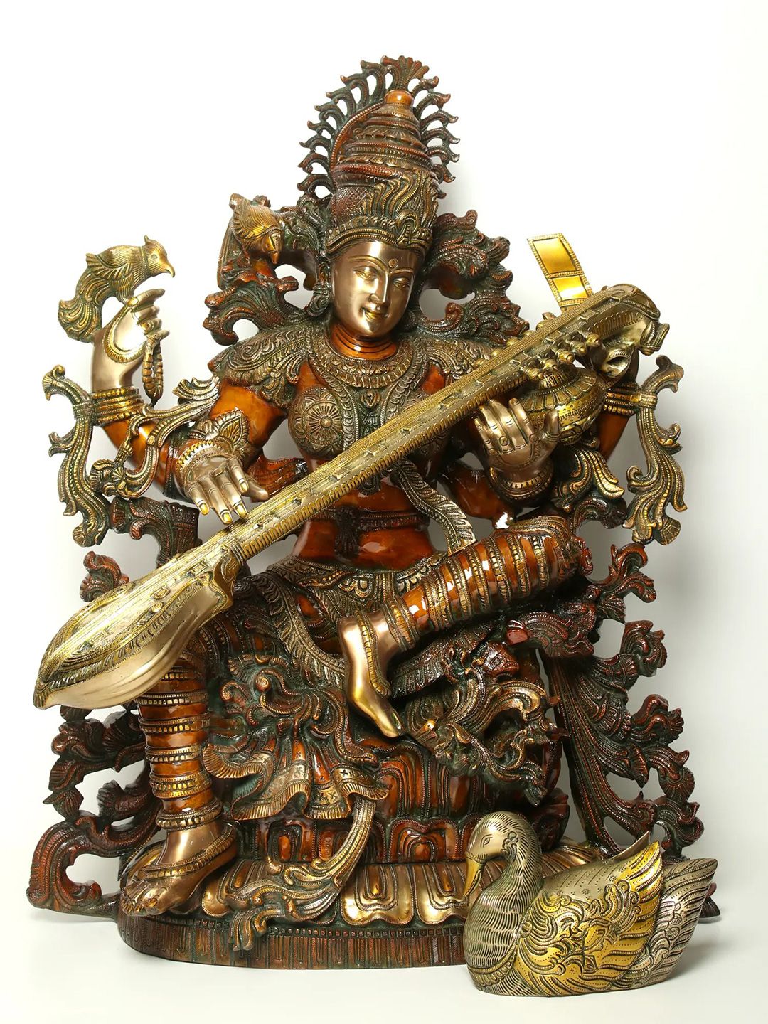 Exotic India Gold-Toned Chaturbhujadharini Devi Saraswati Brass Religious Idol Showpiece-image-17