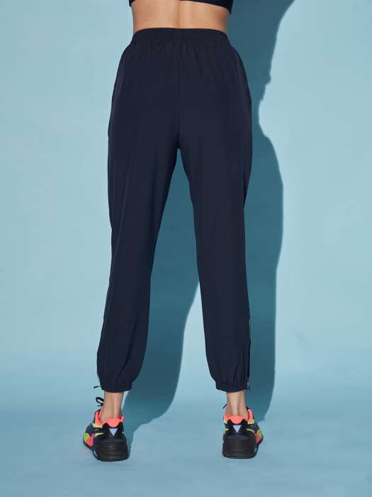 Buy Kica KICA Women Sea Green & White Solid Track Pants at Redfynd