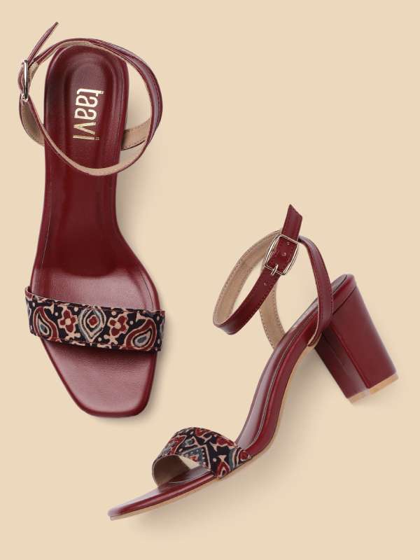 Maroon and gold heels top