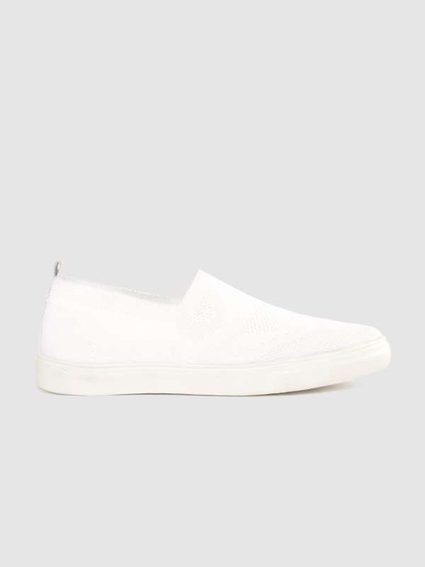 black and white slip on sneakers