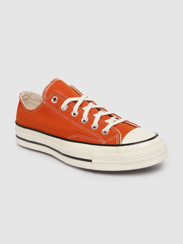 orange chucks low top