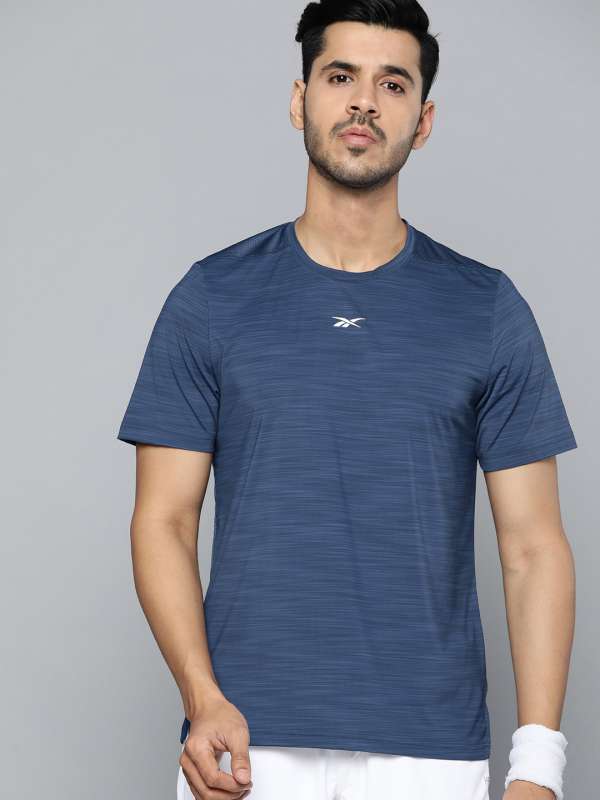 Reebok Men Blue Elements Solid Round Slim T Shirt 300476856.html - Buy Reebok Men Blue Solid Round Neck Slim Fit T Shirt 300476856.html online in India