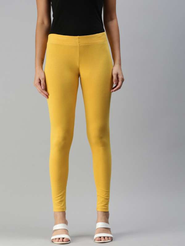 Buy online Yellow Solid Legging from Capris & Leggings for Women by Elleven  By Aurelia for ₹160 at 73% off