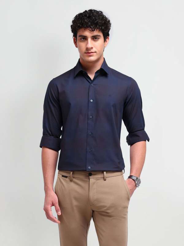 Navy blue shirt and brown pants store