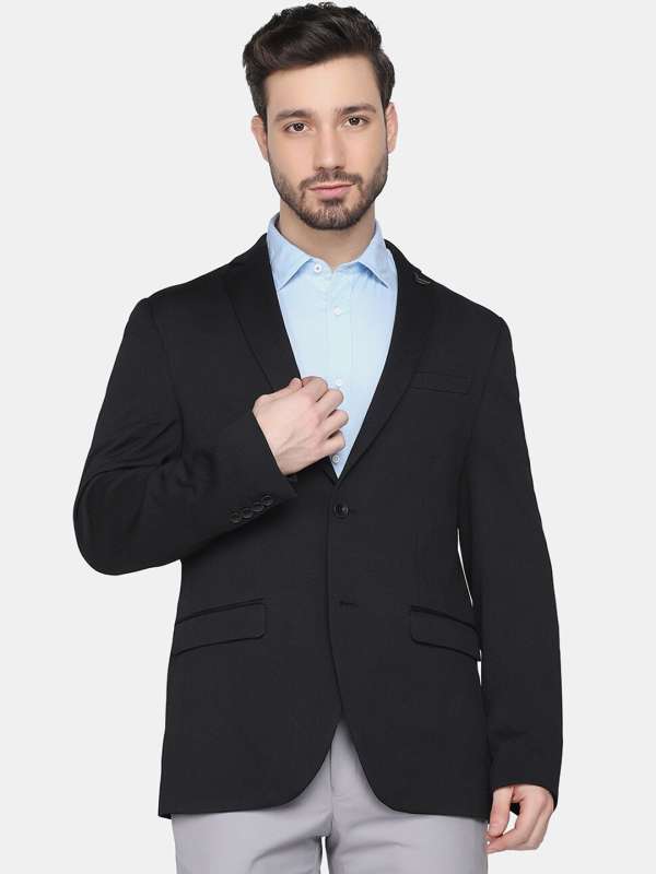 Black blazer with white store shirt
