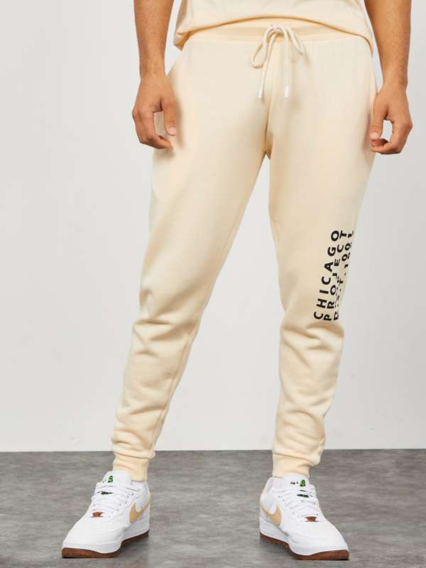 Buy Styli Men Cream Side Placement Print Oversized Joggers - Track