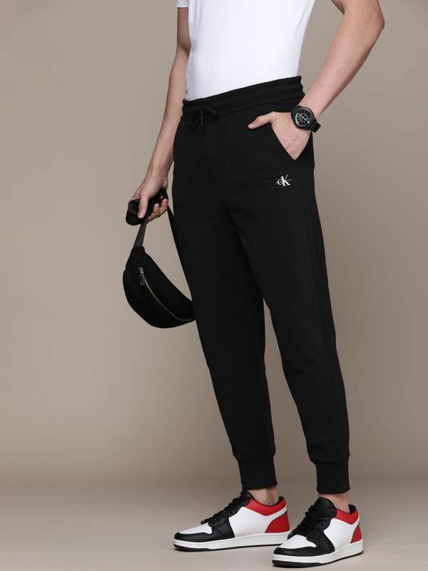 Buy Black Track Pants for Women by Calvin Klein Jeans Online | Ajio.com