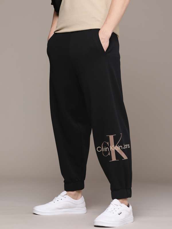 Calvin Klein exclusive to Asos reversed logo cuffed track pants in dark  ocean | ASOS