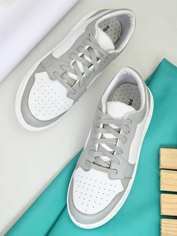 Pair Of Tan Color Leather Sneakers On Jeans Background Closeup View Stock  Photo - Download Image Now - iStock