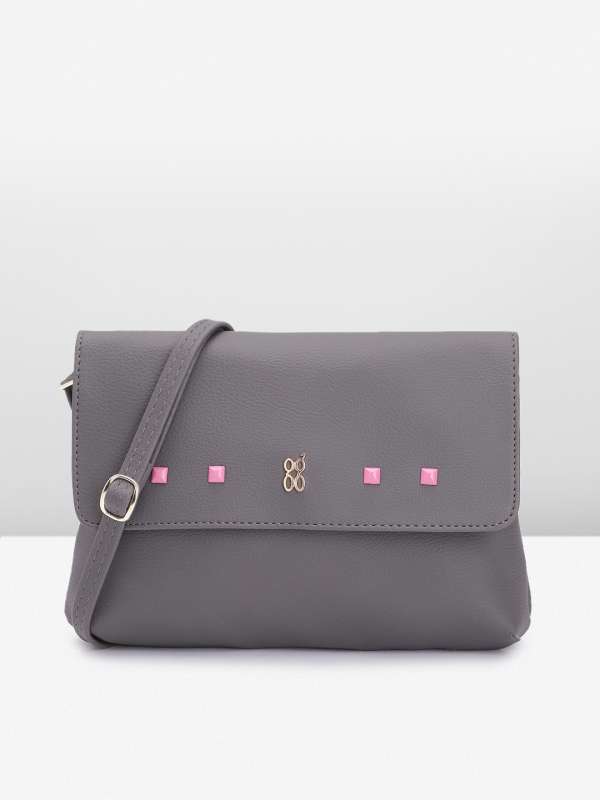 Studded clearance sling bag