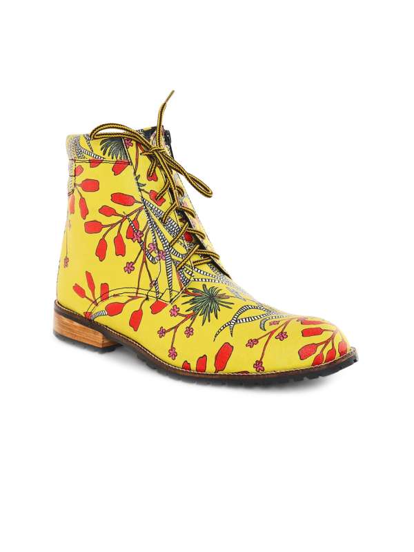 Yellow and black boots best sale