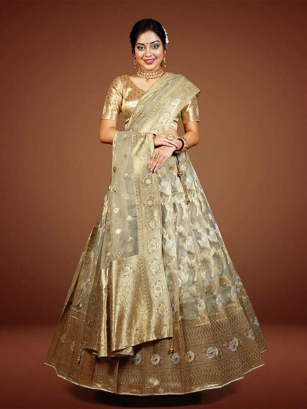 Stunning Golden Colored Partywear Embroidered Netted Lehenga Choli