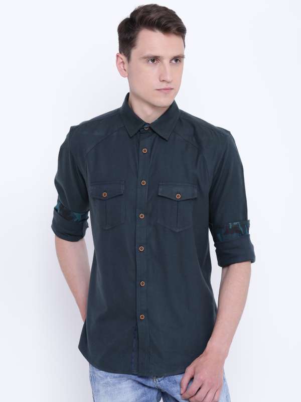 dark green shirt with black jeans