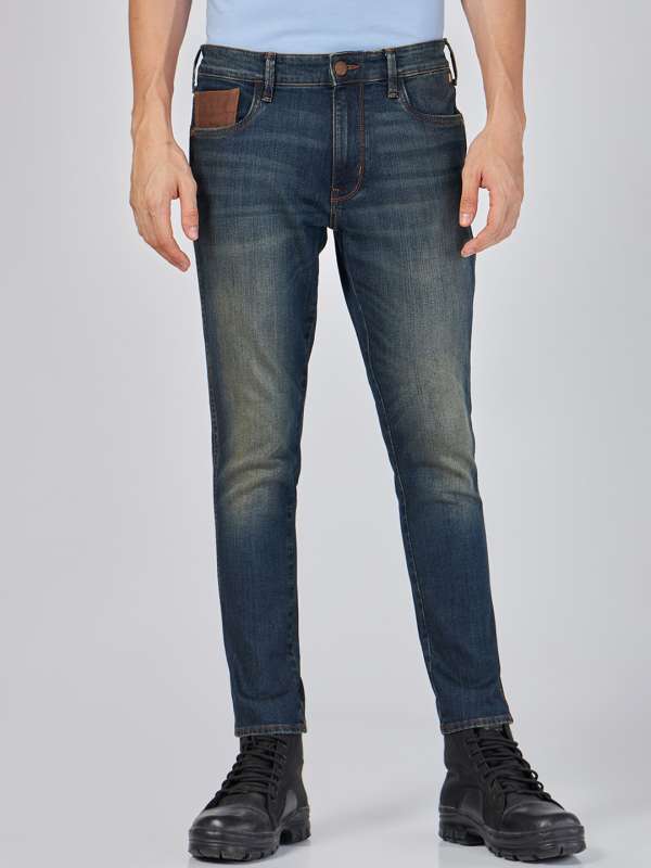 Wrangler Blue Bill Tapered Fit Low Rise Clean Look Stretchable Jogger Jeans 6882008.htm Buy Wrangler Blue Bill Tapered Fit Low Rise Clean Look Stretchable Jogger Jeans 6882008.htm online in India