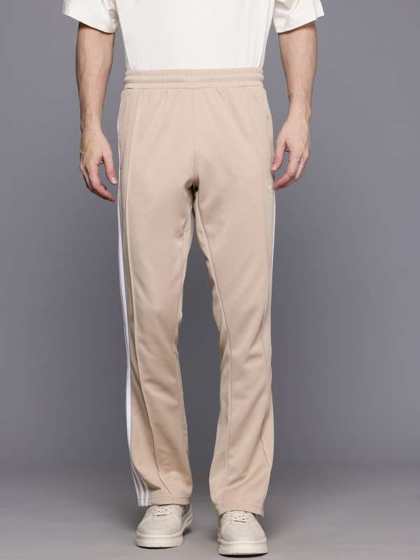 Beige adidas track pants online