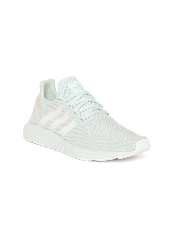 mint green adidas trainers