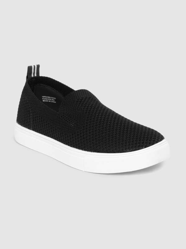 ucb white sneakers myntra