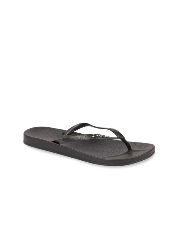 Black thin store strap flip flops