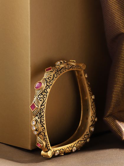 Buy Jewera Set Of 2 Gold Toned Jadau Work Polki Bangles Bangle For Women 4713340 Myntra gold toned jadau work polki bangles