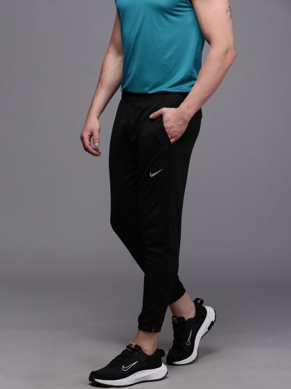 Buy Nike Phenom Essential Men Blue Solid NK ESSENTIAL WOVEN PANT Standard - Track Pants for Men 10139393 | Myntra