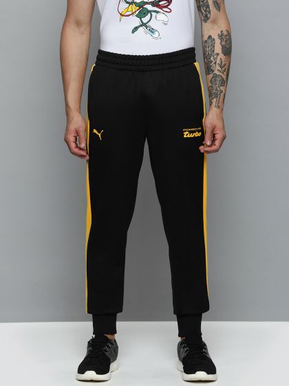 Puma taped side stripe track pants 2025