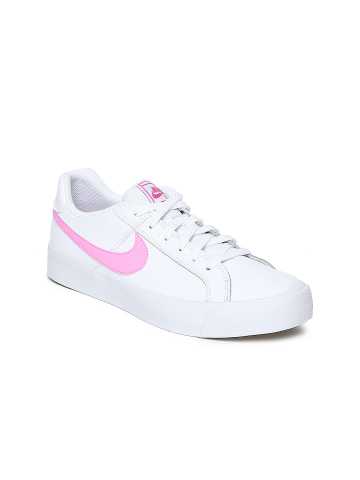 white nike shoes with pink tick