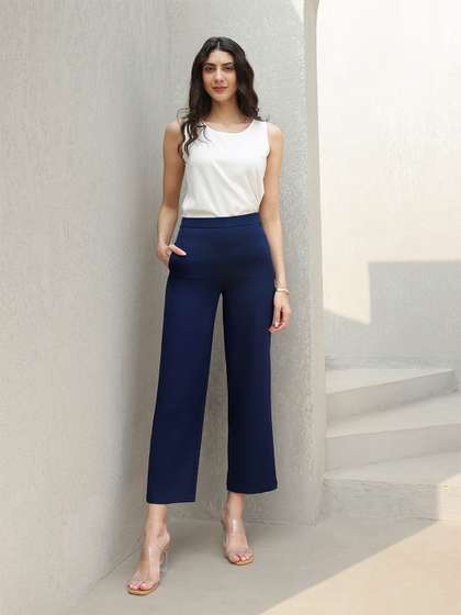 FableStreet Women
                          Navy Blue Flared Solid Parallel Trousers