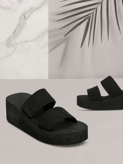 Truffle Collection
                        Women Black Solid Flatform Heels