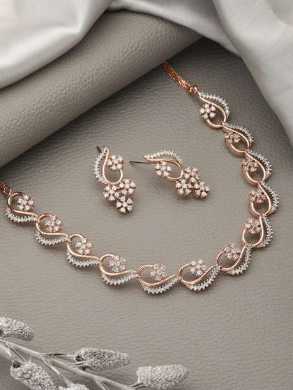 Saraf RS Jewellery
                          Rose Gold-Plated White AD-Studded Jewellery
                          Set