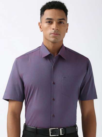 Peter England Men
                        Spread Collar Solid Cotton Formal Shirt