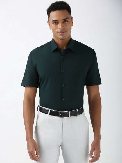 Peter England Men
                        Spread Collar Solid Cotton Formal Shirt