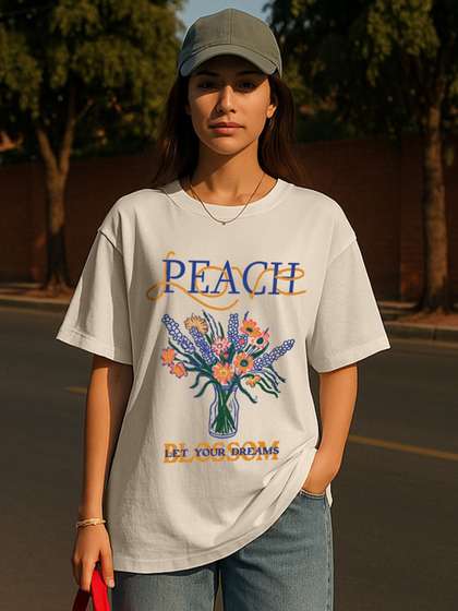 JUNEBERRY Women
                        Cream Floral Printed Round Neck Relaxed Fit Pure
                        Cotton Oversized T-shirt