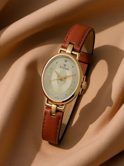 Titan Quartz Analog
                      With Champagne Dial Watch For Women - Nt2594yl01