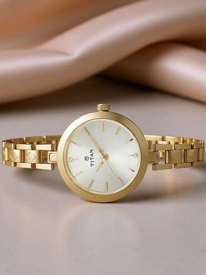 Titan Karishma Quartz
                      Analog With Champagne Dial Watch For Women -
                      Nm2598ym01