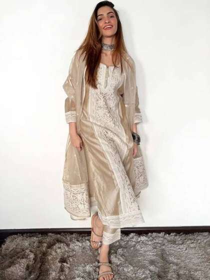 HERE&NOW Women
                          Ethnic Motifs Embroidered Regular Thread Work
                          Kurta with Trousers & With Dupatta