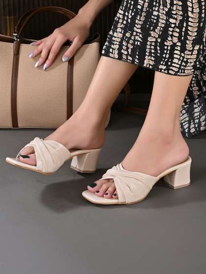 Ravis Women Cream
                        Slip-On Block Heels