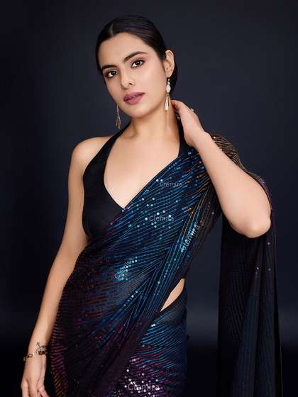 FashionsEye
                        Embellished Sequinned Pure Georgette Saree