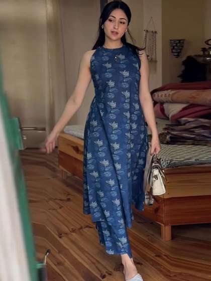 Aaghnya Women
                          Floral Printed Regular Kurta with Palazzos
